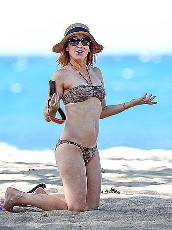 Alyson Hannigan in bikini on a beach in Hawaii