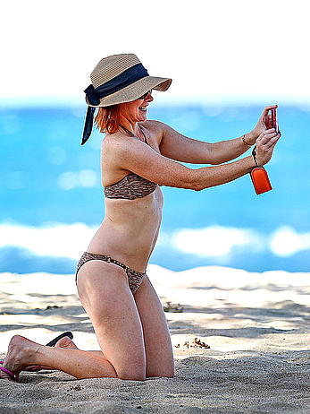 Alyson Hannigan in bikini on a beach in Hawaii