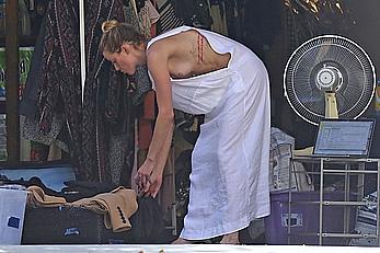 Amber Heard has tit slip while cleaning out her garage