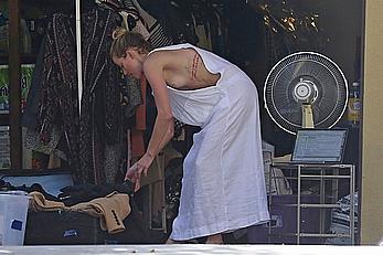 Amber Heard has tit slip while cleaning out her garage