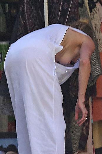 Amber Heard has tit slip while cleaning out her garage