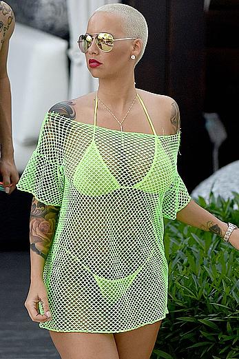 Busty Amber Rose in see through yellow bikini top by the pool in Miami