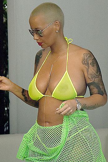 Busty Amber Rose in see through yellow bikini top by the pool in Miami