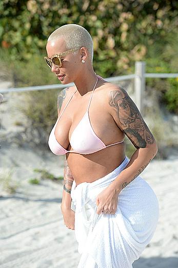 Busty Amber Rose wearing a bikini at a beach in Miami