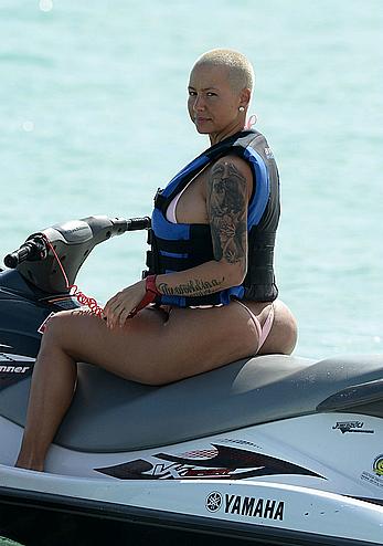 Busty Amber Rose wearing a bikini at a beach in Miami