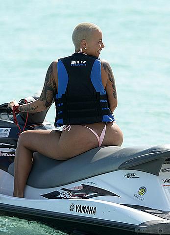 Busty Amber Rose wearing a bikini at a beach in Miami