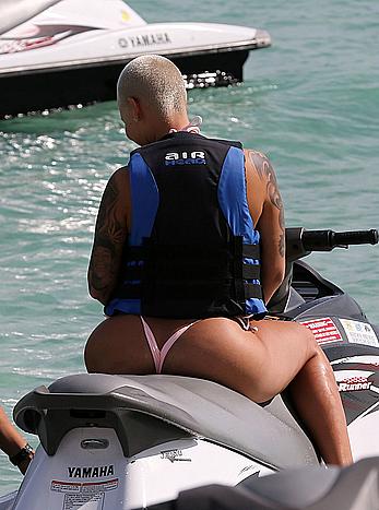 Busty Amber Rose wearing a bikini at a beach in Miami