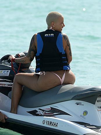 Busty Amber Rose wearing a bikini at a beach in Miami