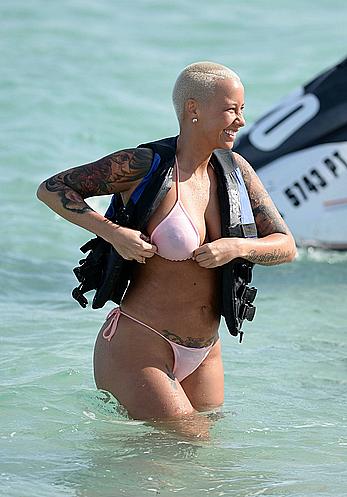 Busty Amber Rose wearing a bikini at a beach in Miami