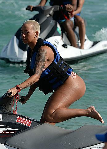 Busty Amber Rose wearing a bikini at a beach in Miami