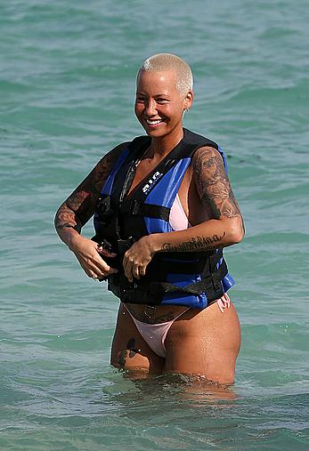 Busty Amber Rose wearing a bikini at a beach in Miami