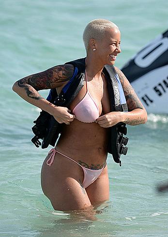 Busty Amber Rose wearing a bikini at a beach in Miami