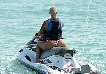 Busty Amber Rose wearing a bikini at a beach in Miami