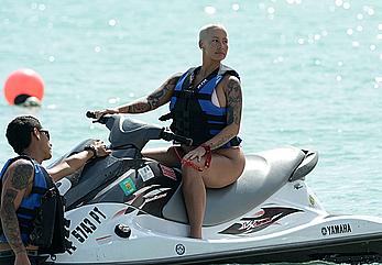 Busty Amber Rose wearing a bikini at a beach in Miami