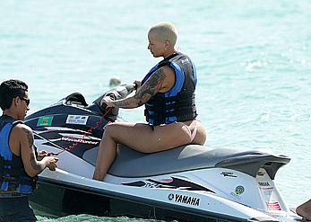 Busty Amber Rose wearing a bikini at a beach in Miami