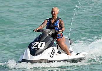 Busty Amber Rose wearing a bikini at a beach in Miami