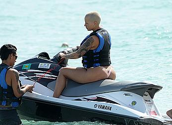 Busty Amber Rose wearing a bikini at a beach in Miami