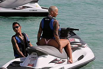 Busty Amber Rose wearing a bikini at a beach in Miami