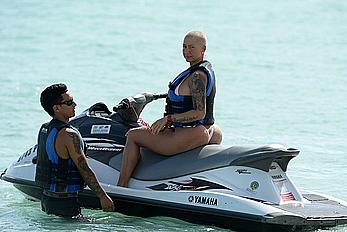 Busty Amber Rose wearing a bikini at a beach in Miami