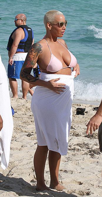 Busty Amber Rose wearing a bikini at a beach in Miami