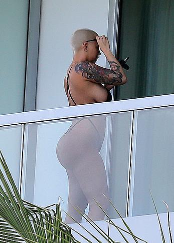 Amber Rose side of boob and big ass on a hotel balcony in Miami