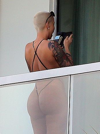 Amber Rose side of boob and big ass on a hotel balcony in Miami