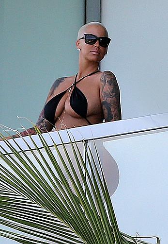 Amber Rose side of boob and big ass on a hotel balcony in Miami