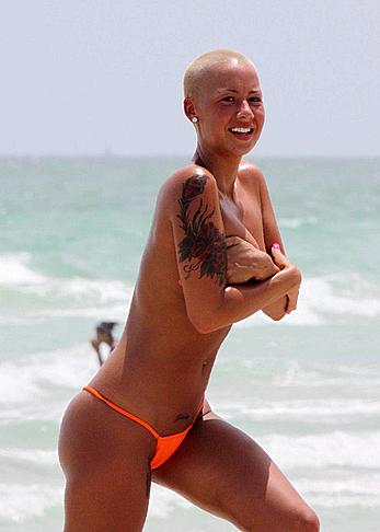 Amber Rose topless on a beach