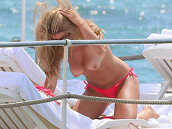 Amy Willerton sunbathing topless in Cannes