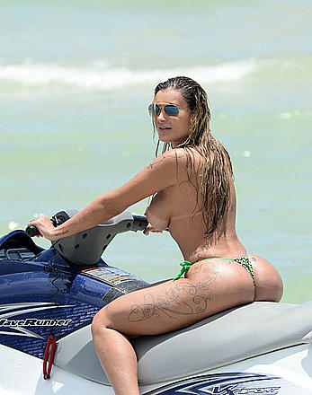 Busty Andressa Urach topless on a beach