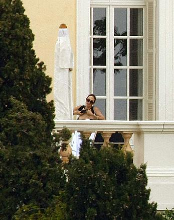 Angelina Jolie caught topless on the hotel balcony