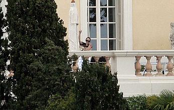 Angelina Jolie caught topless on the hotel balcony