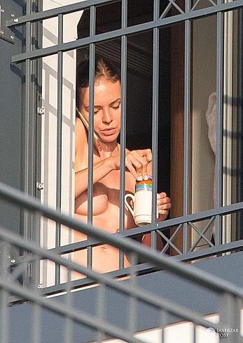 Anna Wendzikowska flashes her boobs and bush on a balcony in her hotel in Warsaw