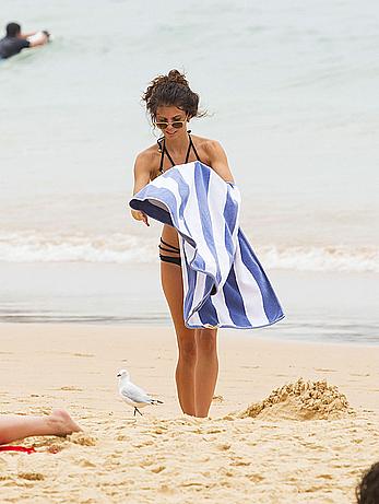 AnnaLynne McCord in black bikini on a beach in Sydney