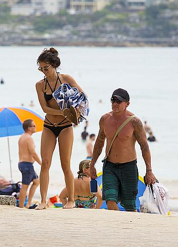 AnnaLynne McCord in black bikini on a beach in Sydney