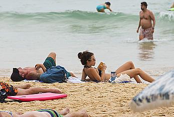 AnnaLynne McCord in black bikini on a beach in Sydney