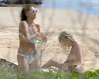 Ashley Benson caught topless at the beach in Hawaii