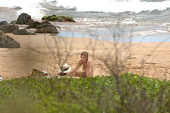 Ashley Benson caught topless at the beach in Hawaii