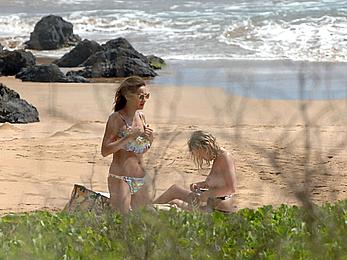 Ashley Benson caught topless at the beach in Hawaii