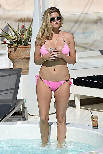 Ashley James in pink bikini at a pool in Mykonos