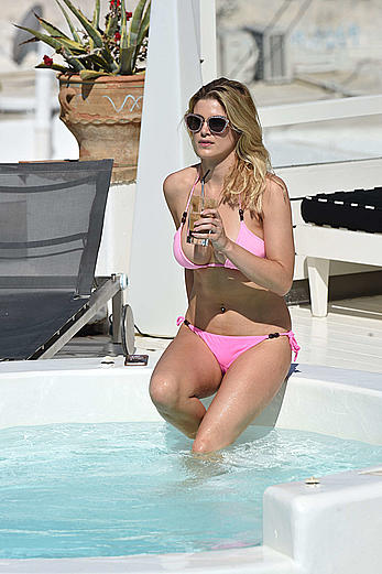 Ashley James in pink bikini at a pool in Mykonos