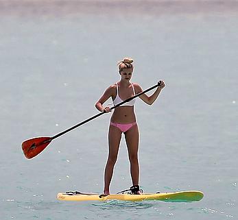 Ava Sambora paddle boarding on vacation in Bora Bora