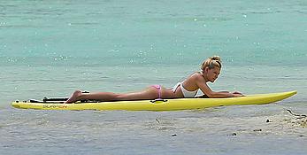 Ava Sambora paddle boarding on vacation in Bora Bora