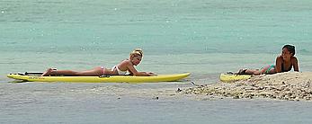 Ava Sambora paddle boarding on vacation in Bora Bora