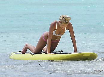 Ava Sambora paddle boarding on vacation in Bora Bora