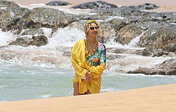 Beyonce Knowles in a swimsuit on a beach in Hawaii