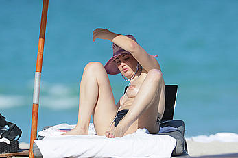 Bleona Qereti sunbathing topless in Miami