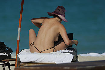 Bleona Qereti sunbathing topless in Miami