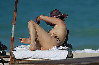 Bleona Qereti sunbathing topless in Miami