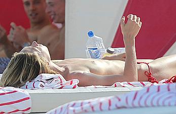 Brianna Addolorato sunbathing topless on a beach in Miami